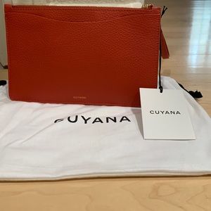 NWT cuyana wristlet in dark coral